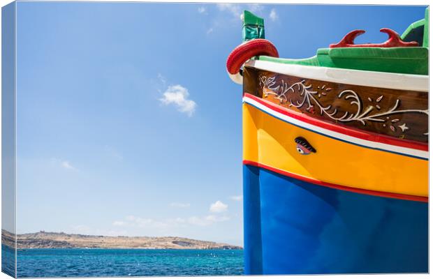Luzzu boat next to the blue water Canvas Print by Jason Wells