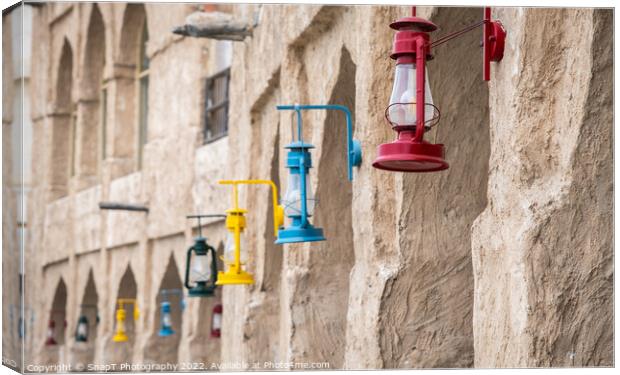 Colored lanterns hanging in old town Souq Waqif, Doha, Qatar Canvas Print by SnapT Photography