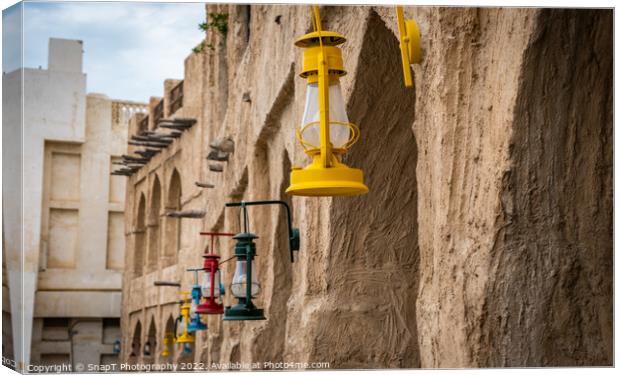 Colored lanterns hanging in old town Souq Waqif, Doha, Qatar Canvas Print by SnapT Photography