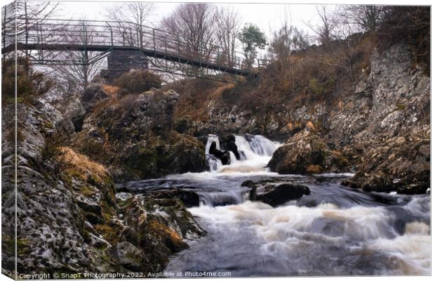 Waterfall on the Polmaddy Burn, below Polmaddy Settlement, during winter Canvas Print by SnapT Photography
