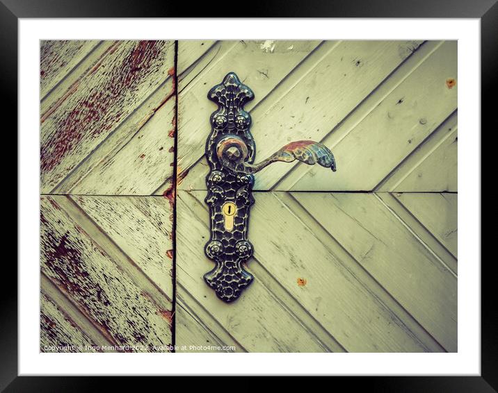 Abstract A closeup of the metal door handle on a weathered wooden door Framed Mounted Print by Ingo Menhard