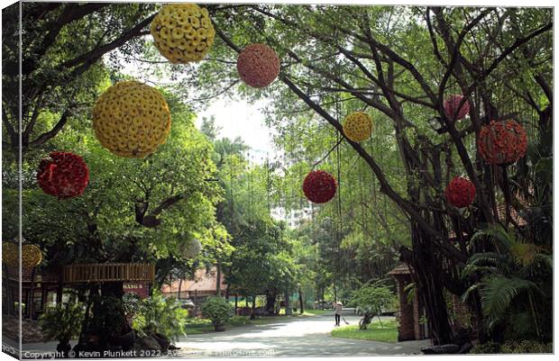 Hanging flower decorations. Canvas Print by Kevin Plunkett