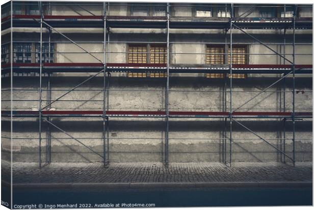 Artistic shot of a building withscaffolding Canvas Print by Ingo Menhard