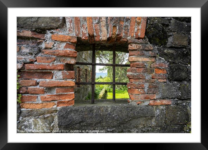 loopholes in the old castle walls Framed Mounted Print by Sergio Delle Vedove