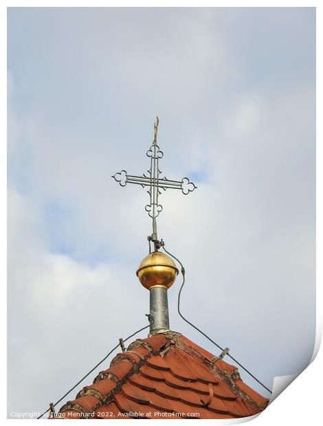 A vertical shot of a metallic cross on a cloudy sky background. Print by Ingo Menhard