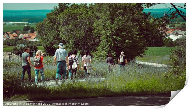 Group of wanderers at the Friedrichsberg in Bavaria walking to the village of Abtswind Print by Ingo Menhard