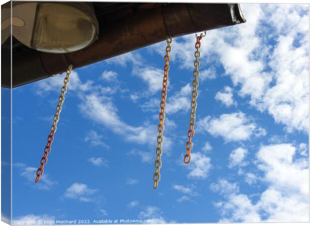A low angle shot of hanging chains against cloudy sky Canvas Print by Ingo Menhard