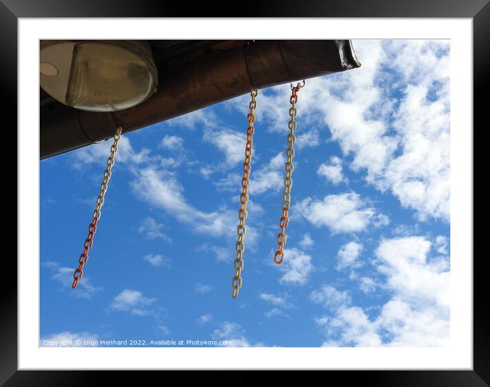 A low angle shot of hanging chains against cloudy sky Framed Mounted Print by Ingo Menhard