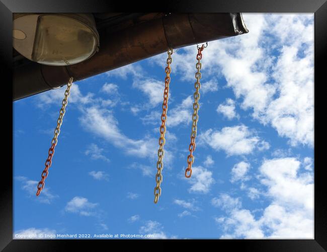 A low angle shot of hanging chains against cloudy sky Framed Print by Ingo Menhard