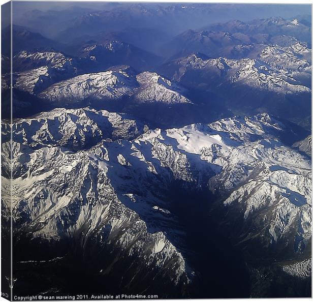 The Alps at 38000 Canvas Print by Sean Wareing