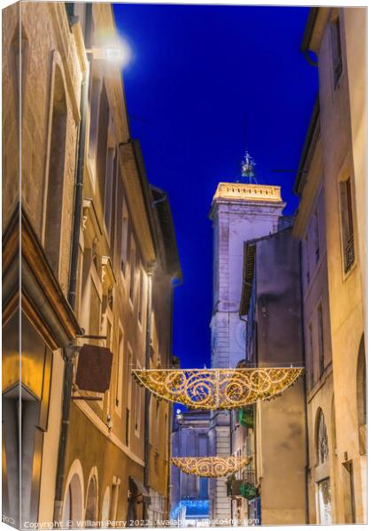 Christmas Decorations Old Clock Tower Street Nimes Gard France Canvas Print by William Perry