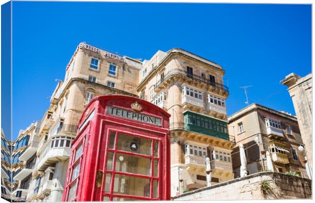 Red phone box in Valletta Canvas Print by Jason Wells