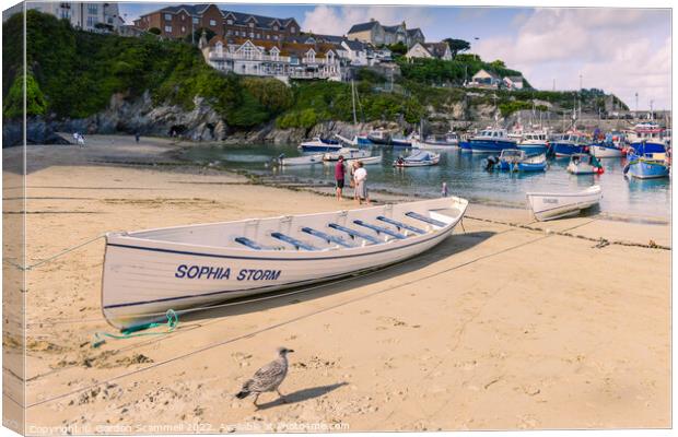Traditional pilot gigs beached on the beach in Newquay Harbour in Cornwall Canvas Print by Gordon Scammell