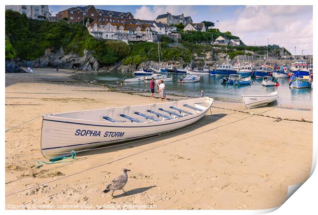 Traditional pilot gigs beached on the beach in Newquay Harbour in Cornwall Print by Gordon Scammell