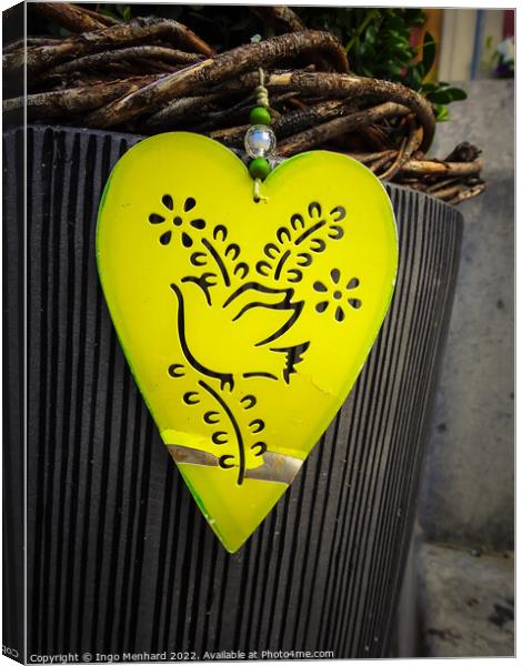 The close-up shot of a yellow heart-shaped decoration Canvas Print by Ingo Menhard