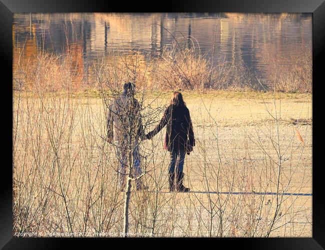 Scenic shot of a couple walking around the lake Framed Print by Ingo Menhard