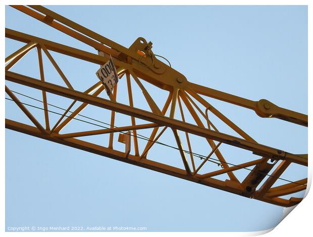 A low angle shot of a part of a construction crane against the clear blue sky Print by Ingo Menhard