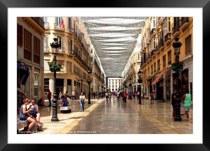 People shopping on Marques de Larios. Framed Mounted Print by Kevin Hellon