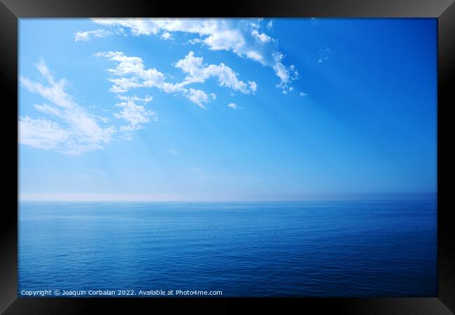 A deep blue in the sea, background with the calm and infinite co Framed Print by Joaquin Corbalan