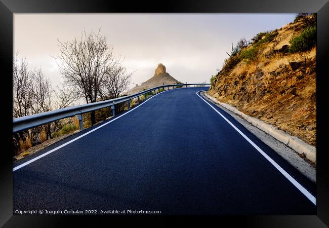 Roque Bentayga seen from the road on a beautiful and misty day Framed Print by Joaquin Corbalan