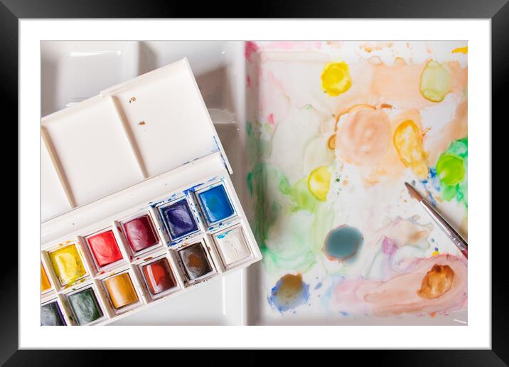 box of watercolors on a paint-stained palette Framed Mounted Print by David Galindo