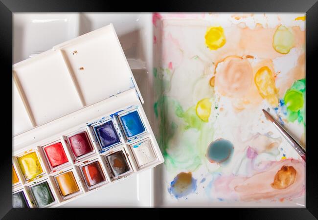 box of watercolors on a paint-stained palette Framed Print by David Galindo