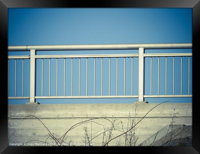 Closeup shot of iron porch railings on a blue sky background Framed Print by Ingo Menhard