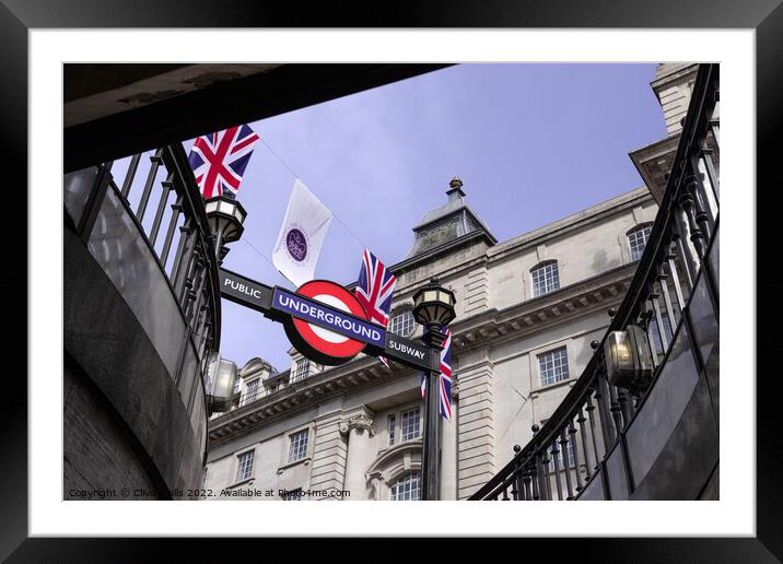 Bunting above the tube station Framed Mounted Print by Clive Wells