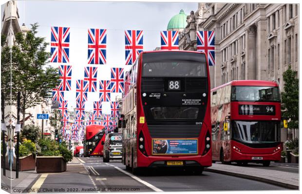 Regent Street with bunting and buses Canvas Print by Clive Wells