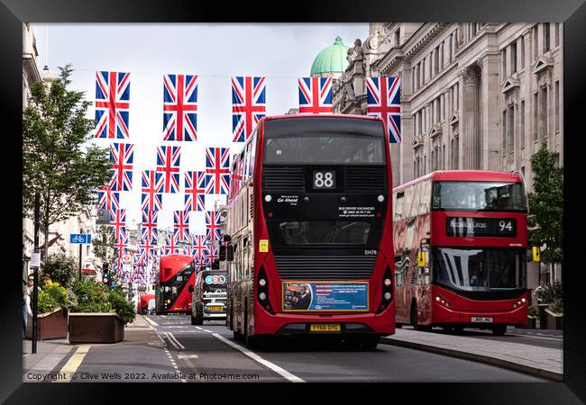 Regent Street with bunting and buses Framed Print by Clive Wells
