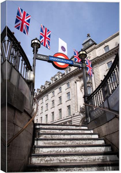 Bunting for the Queen`s Platinum Jubilee seen above Piccadilly  underground station in London, taken 21st May 2022. Canvas Print by Clive Wells