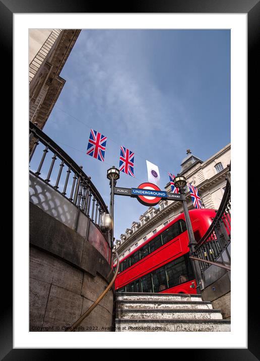 Bunting above the tube station with London bus. Framed Mounted Print by Clive Wells
