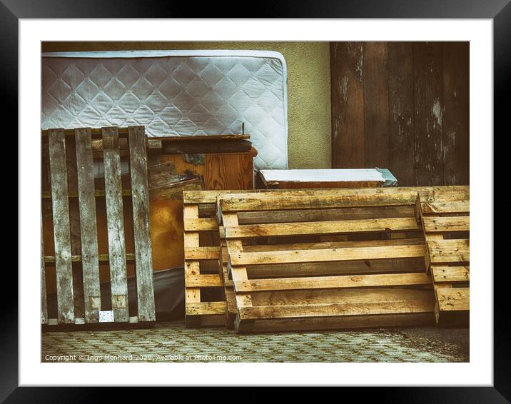 Shot of pallets leaning against the wall with old furniture and mattress Framed Mounted Print by Ingo Menhard