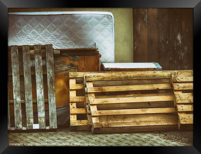 Shot of pallets leaning against the wall with old furniture and mattress Framed Print by Ingo Menhard