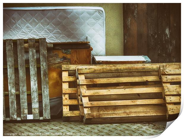 Shot of pallets leaning against the wall with old furniture and mattress Print by Ingo Menhard