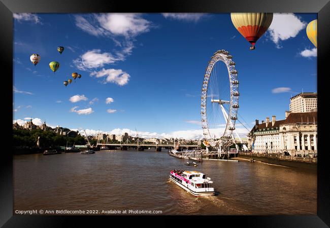 London eye as hot air balloon's fly over Framed Print by Ann Biddlecombe