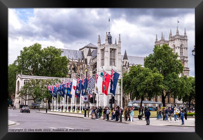 Flags in front of West Minister Cathedral. Framed Print by Clive Wells