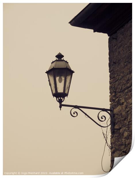 Closeup of a vintage wall-mounted lantern in the light background Print by Ingo Menhard