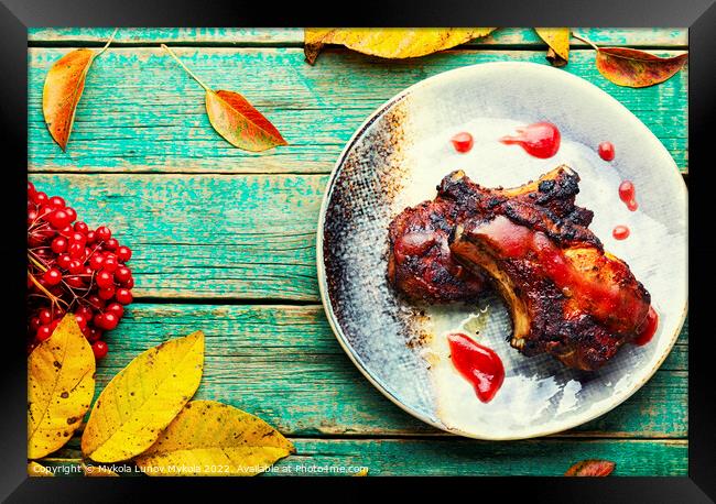 Steak with autumn berries on wooden table Framed Print by Mykola Lunov Mykola