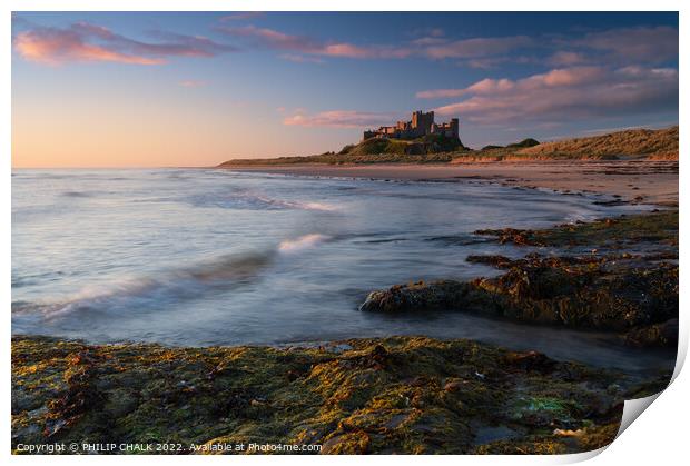 Sunrise glow over Bamburgh castle on the Northumbe Print by PHILIP CHALK