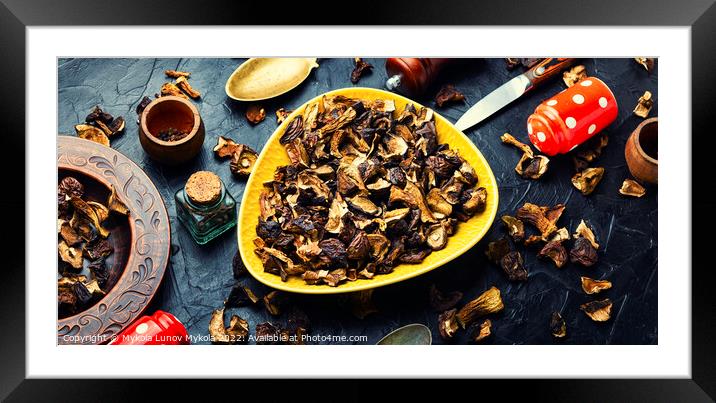 Dried mushrooms and cooking utensils Framed Mounted Print by Mykola Lunov Mykola