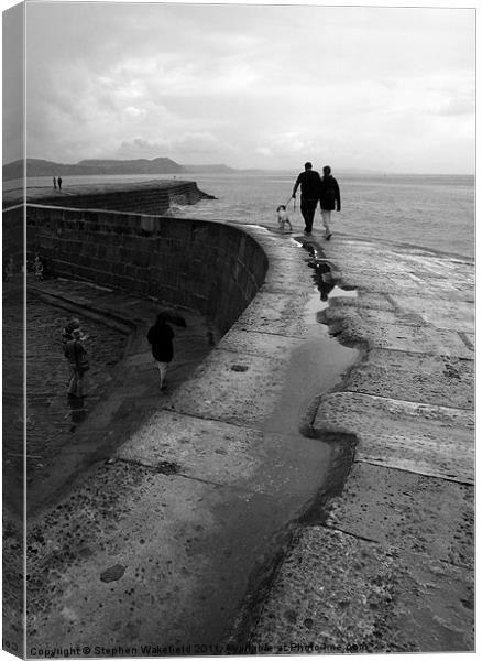 Stroll on the Cobb Canvas Print by Stephen Wakefield