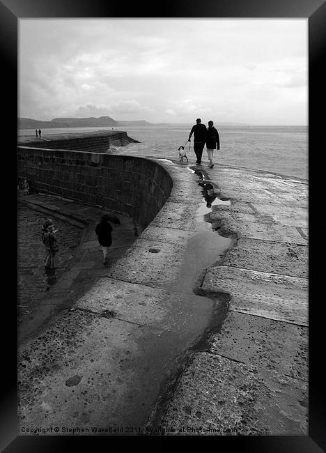 Stroll on the Cobb Framed Print by Stephen Wakefield