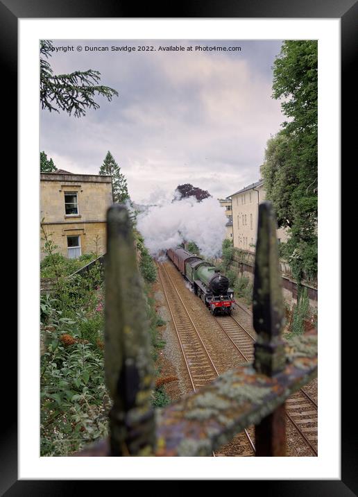 Mayflower steam train through the railings  Framed Mounted Print by Duncan Savidge