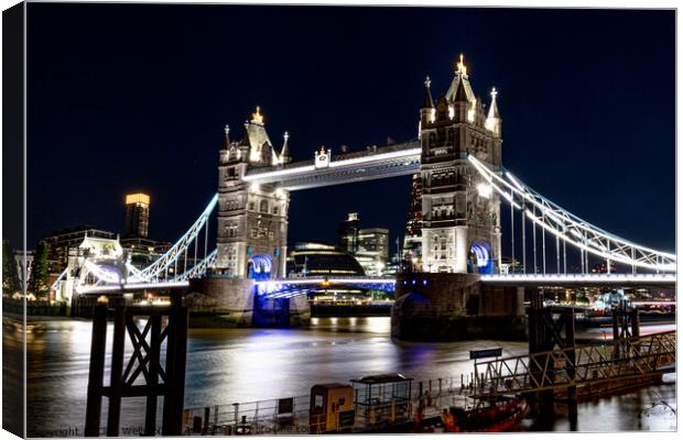 Tower Bridge at night Canvas Print by Clive Wells