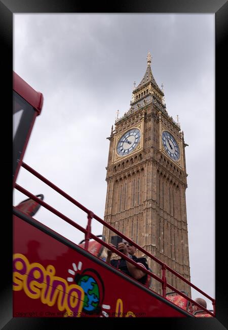 Open top bus under the Elizabeth Tower Framed Print by Clive Wells