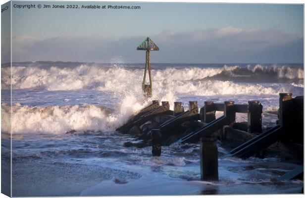 Winter Sunshine and a Stormy Sea Canvas Print by Jim Jones