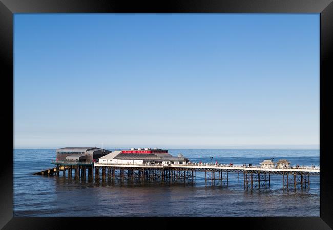 Cromer pier under a blue sky Framed Print by Jason Wells