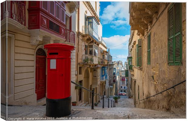 Red vintage mail box in Malta Canvas Print by Maria Vonotna