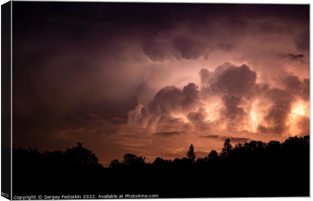 Lightning in the sky during a storm at night Canvas Print by Sergey Fedoskin